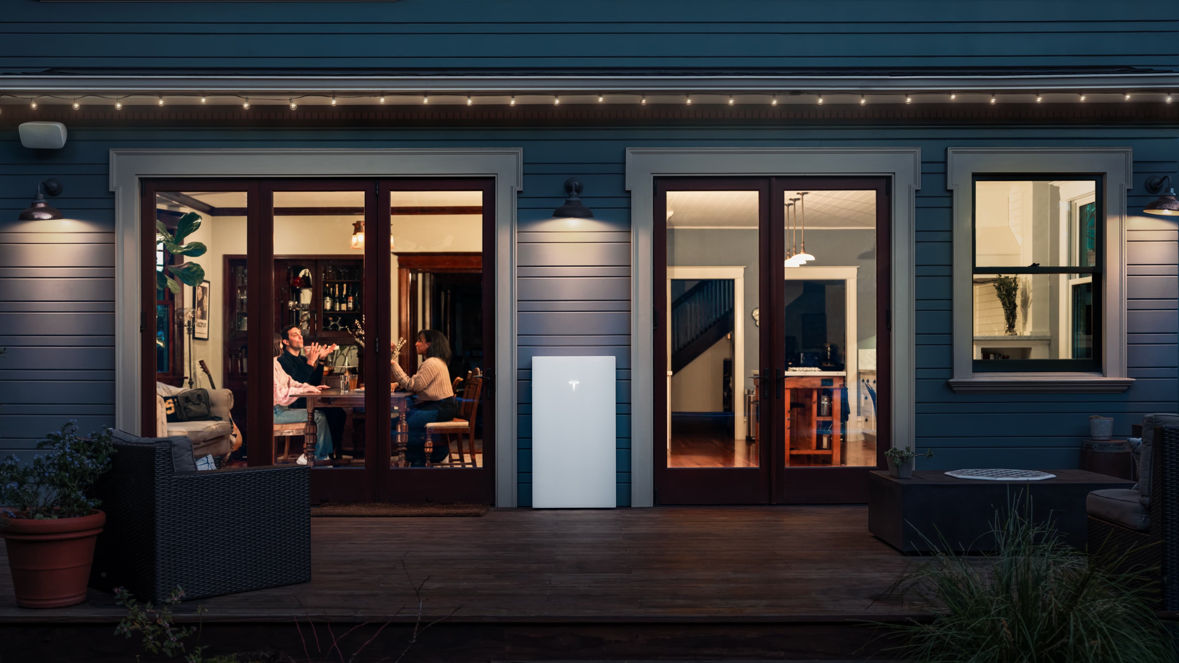 Tesla Powerwall home battery installed on a Florida home at dusk